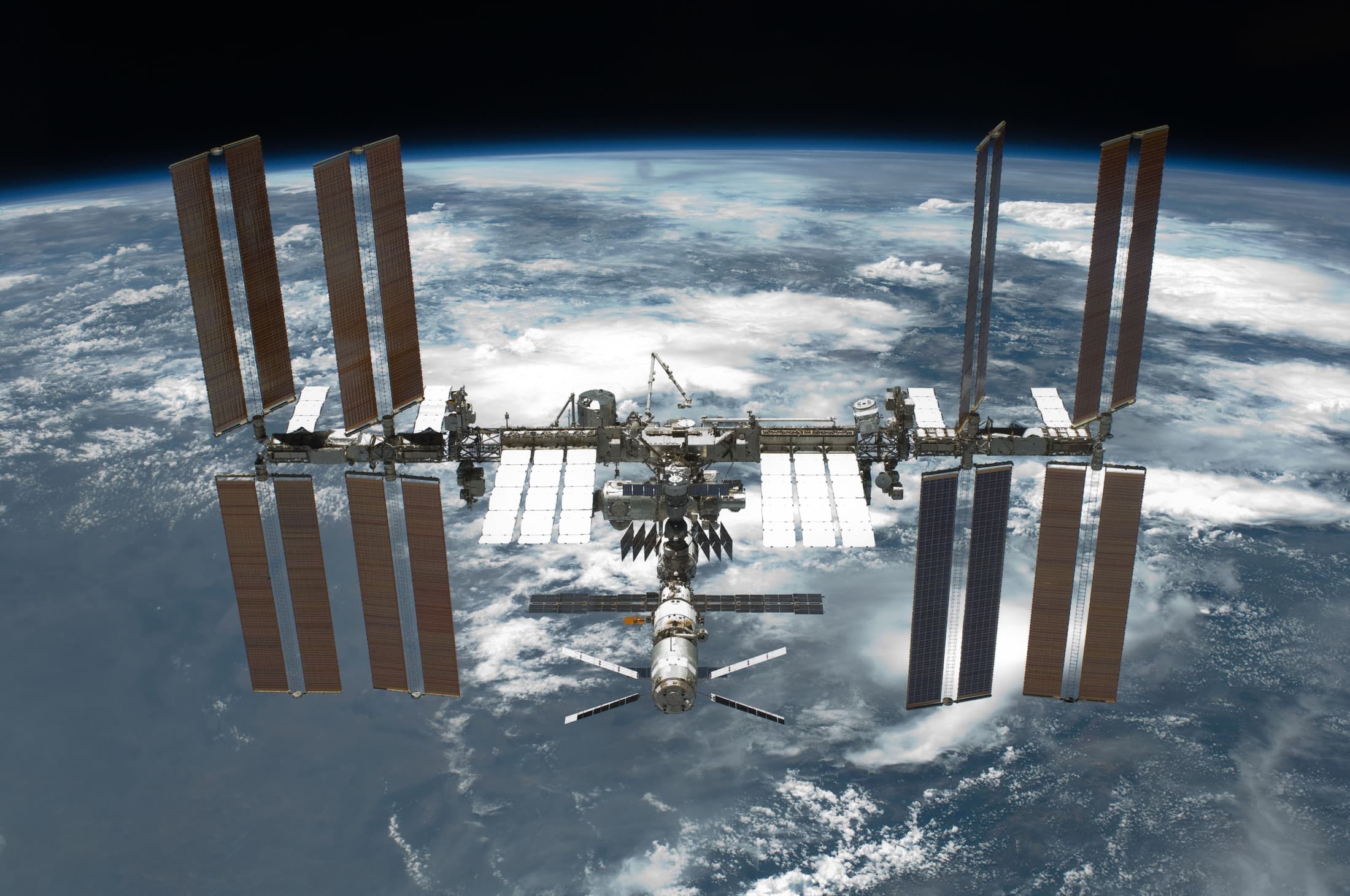 The International Space Station above Earth in a NASA archive photograph from May 2011.