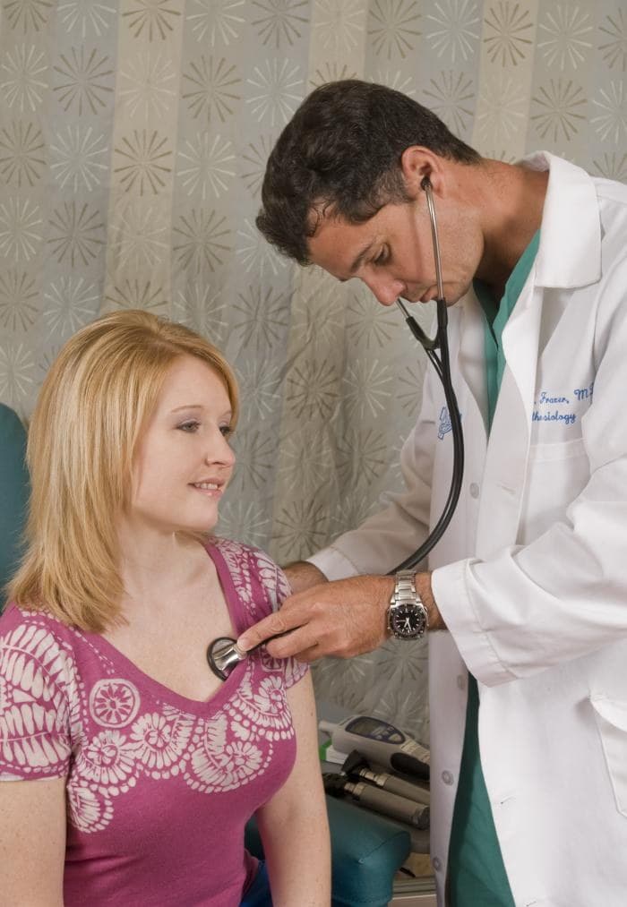 Archive illustrative photograph: physician examines a patient with a stethoscope; neither person identified as a survey participant.