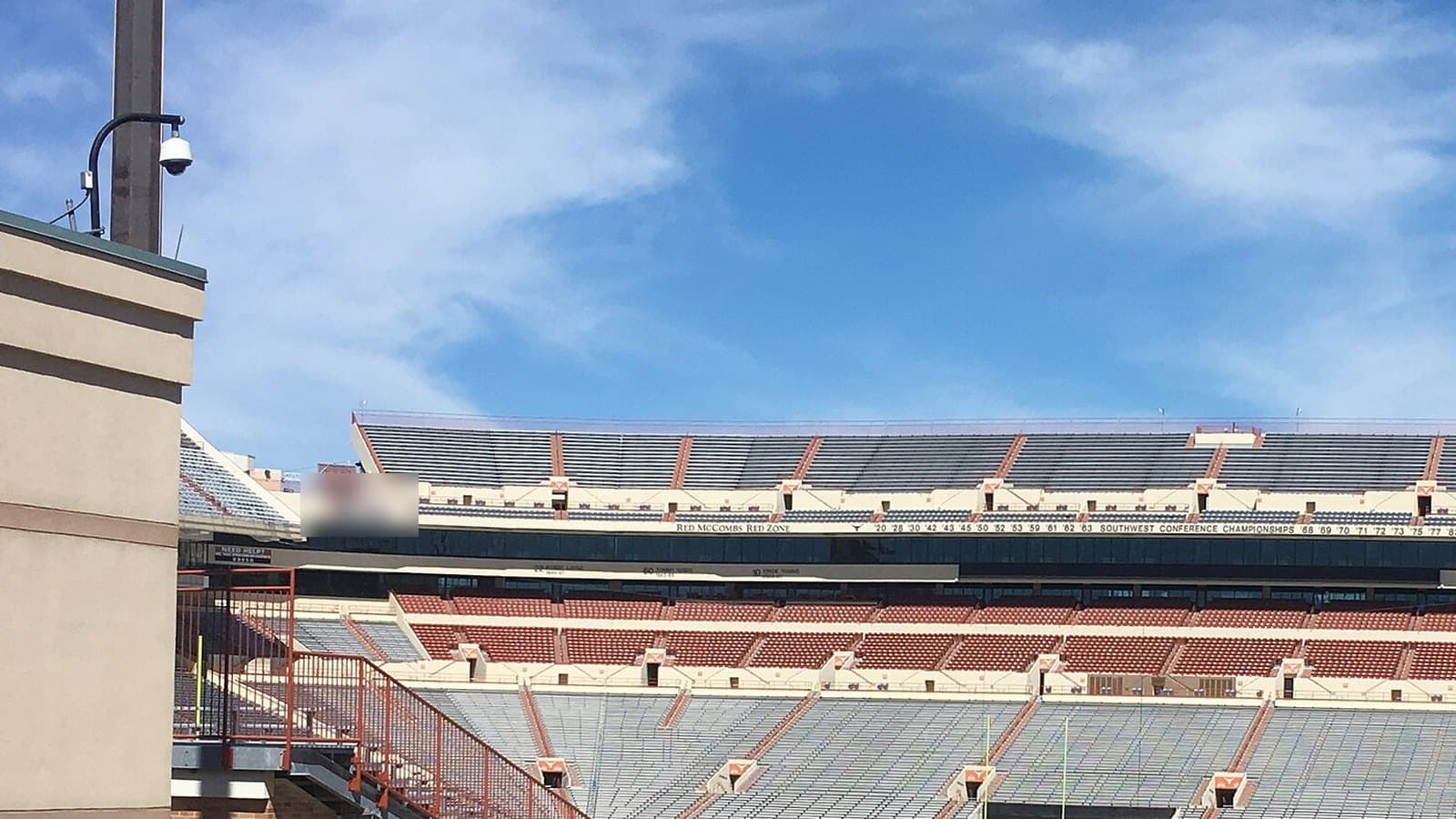 Stands of Darrell K Royal-Texas Memorial Stadium in Austin on a clear day.
