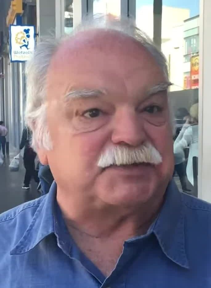 Richard Riehle, with white hair and a mustache, in a 2016 archive video.