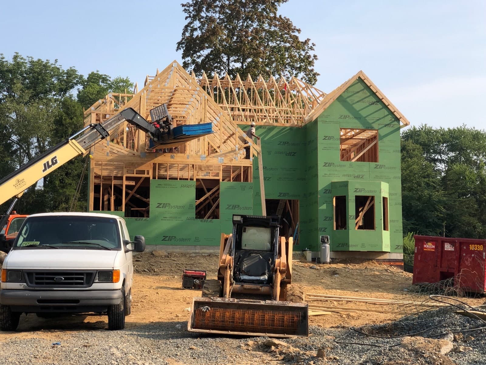 Wood-frame house under construction along Perry Drive in Ewing Township, New Jersey, in August 2024.