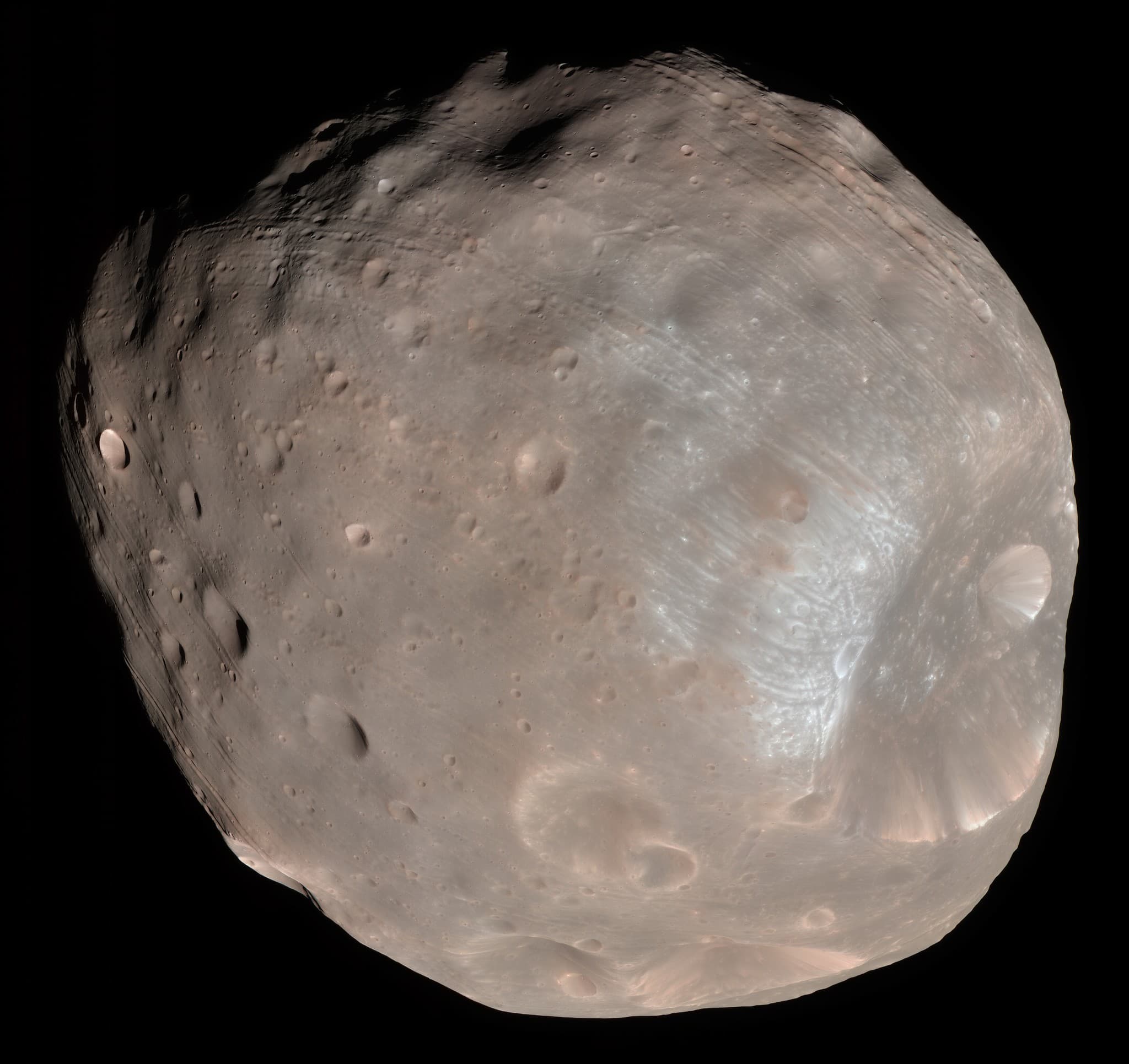 Archival enhanced-color spacecraft photograph of Phobos showing the large Stickney crater.